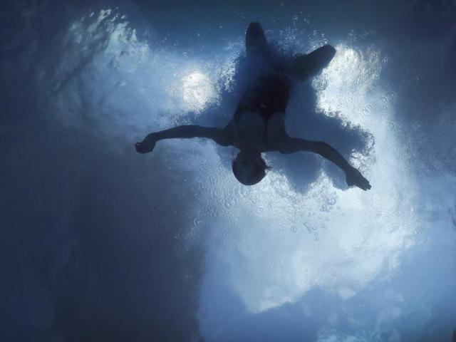 China's Wu Minxia lands underwater during a training session at the Maria Lenk Aquatic Center on Thursday. (AP Photo) (AP)