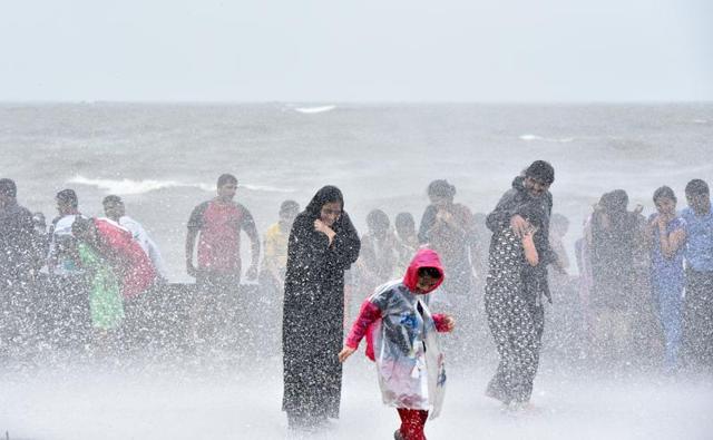 Mumbai, India - Aug. 5, 2016:People enjoy during a high tide at Worli seaface in Mumbai on Friday. (Pratik Chorge) 