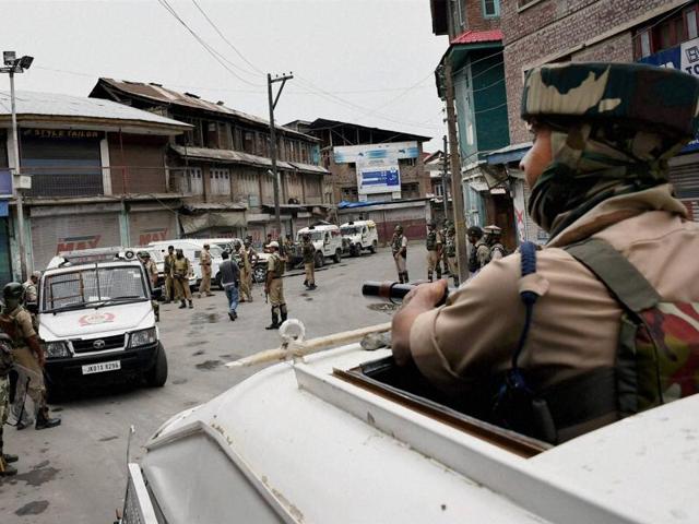 A paramilitary trooper stands guard during curfew in Kashmir. More than 50 people have been killed and thousands injured in weeks of unrest, sparked by the death of militant commander Burhan Wani on July 8. (AFP Photo) A paramilitary trooper stands guard during curfew in Kashmir. More than 50 people have been killed and thousands injured in weeks of unrest, sparked by the death of militant commander Burhan Wani on July 8. (AFP Photo)