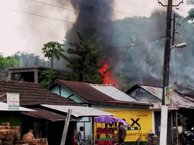Smoke billowing out of shops after an attack by NDFB-S militants in the market area at Balajan Tinali near Kokrajhar town in Assam on Friday.(PTI) Smoke billowing out of shops after an attack by NDFB-S militants in the market area at Balajan Tinali near Kokrajhar town in Assam on Friday.(PTI)