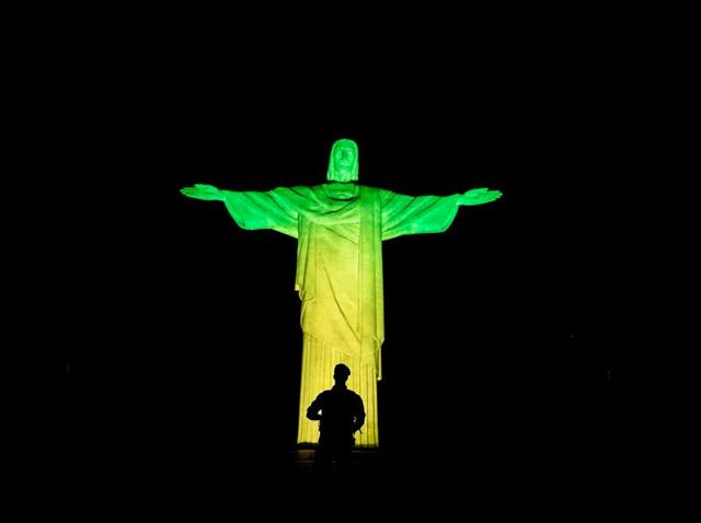 A Brazilian soldier stands guard in front of the Christ the Redeemer on Corcovado mountain ahead of the Rio 2016 Olympic Games. (AFP Photo) (AFP)