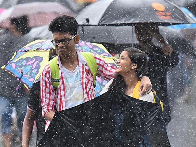 Mumbai, India - Aug. 5, 2016:  Youngsters enjoy as the heavy rains lashes the city, in Goregaon  (Vidya Subramanian) 