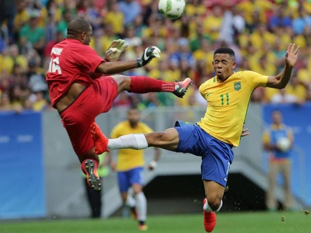 Brazil's Gabriel Barbosa, top, and South Africa goalkeeper Itumeleng Khune tangle on the field during the group A match of the men's Olympic football tournament between Brazil and South Africa. (AP Photo) (AP) Brazil's Gabriel Barbosa, top, and South Africa goalkeeper Itumeleng Khune tangle on the field during the group A match of the men's Olympic football tournament between Brazil and South Africa. (AP Photo) (AP)