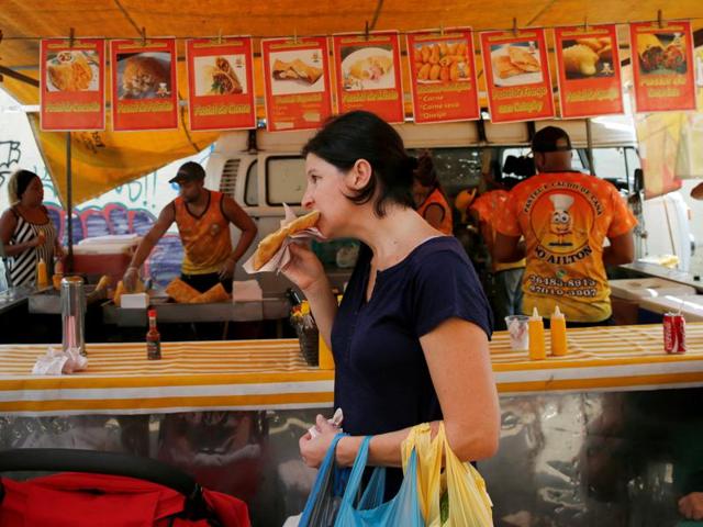 While you can find fine restaurants in Rio, what sets the city apart and brings its residents, known as ‘Cariocas,’ together is the unpretentious food they eat in crowded bars and on busy street corners after a day at the beach. (REUTERS) While you can find fine restaurants in Rio, what sets the city apart and brings its residents, known as ‘Cariocas,’ together is the unpretentious food they eat in crowded bars and on busy street corners after a day at the beach. (REUTERS)