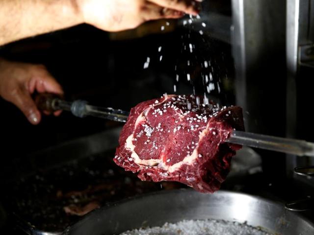 A man prepares meat for churrasco. While Brazilian churrasco features everything from pork, sausage, and chicken hearts, you’ll want to order the irrefutable star of the show, picanha, referred to as rump cap in English and considered the best cut of beef in Brazil. (REUTERS) A man prepares meat for churrasco. While Brazilian churrasco features everything from pork, sausage, and chicken hearts, you’ll want to order the irrefutable star of the show, picanha, referred to as rump cap in English and considered the best cut of beef in Brazil. (REUTERS)