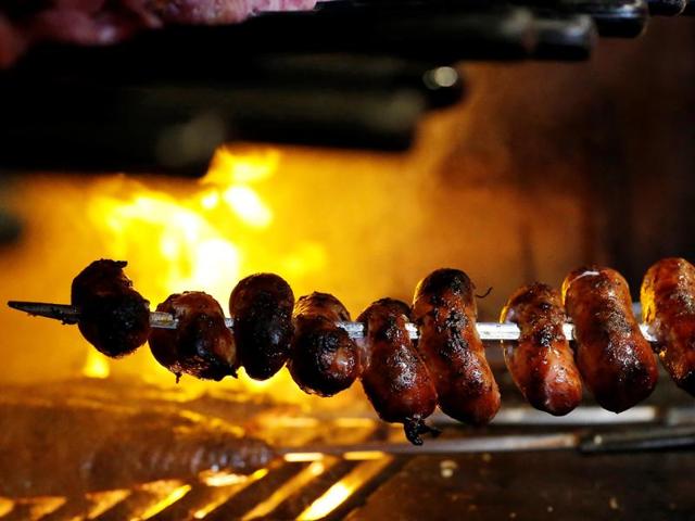 Characterised by a thick layer of fat, the meat is skewered on swords and seasoned with just a sprinkling of coarse salt so as not to mask its flavour. (REUTERS) Characterised by a thick layer of fat, the meat is skewered on swords and seasoned with just a sprinkling of coarse salt so as not to mask its flavour. (REUTERS)
