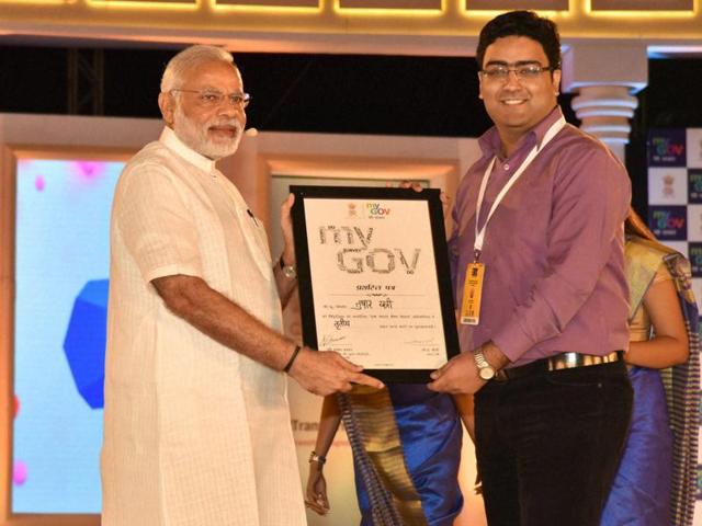 Prime Minister Narendra Modi distributes a certificate to a contest of MyGov at the second anniversary celebrations of MyGov, in New Delhi on Saturday.(PTI)