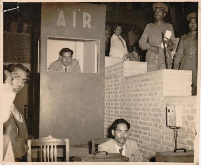 Melville de Mellow (inside the announcer’s booth), a former Armyman, was known as the Voice of AIR in the Fifties. Here, he is seen on an out-of-office assignment. He is remembered for a seven-hour running commentary during Mahatma Gandhi’s funeral. (Photo courtesy: AIR) Melville de Mellow (inside the announcer’s booth), a former Armyman, was known as the Voice of AIR in the Fifties. Here, he is seen on an out-of-office assignment. He is remembered for a seven-hour running commentary during Mahatma Gandhi’s funeral. (Photo courtesy: AIR)