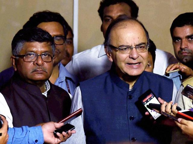 Finance minister Arun Jaitley addressing a press conference at Parliament House after the Goods and Services Tax (GST) bill was passed by the Rajya Sabha in New Delhi on Wednesday evening. (PTI) Finance minister Arun Jaitley addressing a press conference at Parliament House after the Goods and Services Tax (GST) bill was passed by the Rajya Sabha in New Delhi on Wednesday evening. (PTI)