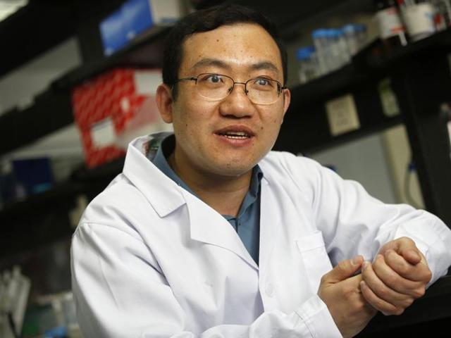 In this April 13, 2016 photo, Chen Xiaowei, an assistant professor at Peking University, speaks during an interview at the school's campus in Beijing. China is recruiting thousands of high-achieving overseas Chinese to come home through the 1,000 Talents program, one of many state efforts launched in recent years to reverse a decades-long brain drain. (AP Photo) In this April 13, 2016 photo, Chen Xiaowei, an assistant professor at Peking University, speaks during an interview at the school's campus in Beijing. China is recruiting thousands of high-achieving overseas Chinese to come home through the 1,000 Talents program, one of many state efforts launched in recent years to reverse a decades-long brain drain. (AP Photo)