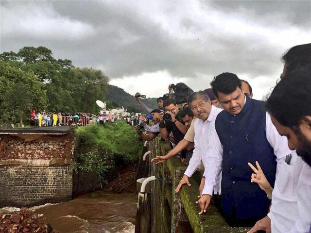 Maharashtra chief minister Devendra Fadnavis visits the Mahad-Poladpur bridge, which was washed away by flood waters on Tuesday. (PTI) Maharashtra chief minister Devendra Fadnavis visits the Mahad-Poladpur bridge, which was washed away by flood waters on Tuesday. (PTI)