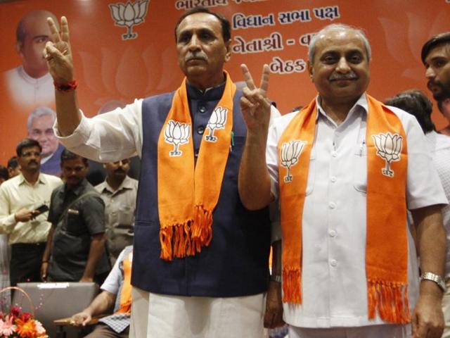 Gujarat chief minister designate Vijay Rupani with his deputy Nitin Patel during a legislative meeting in Gandhinagar. (Ajit Slonaki/HT Photo) Gujarat chief minister designate Vijay Rupani with his deputy Nitin Patel during a legislative meeting in Gandhinagar. (Ajit Slonaki/HT Photo)