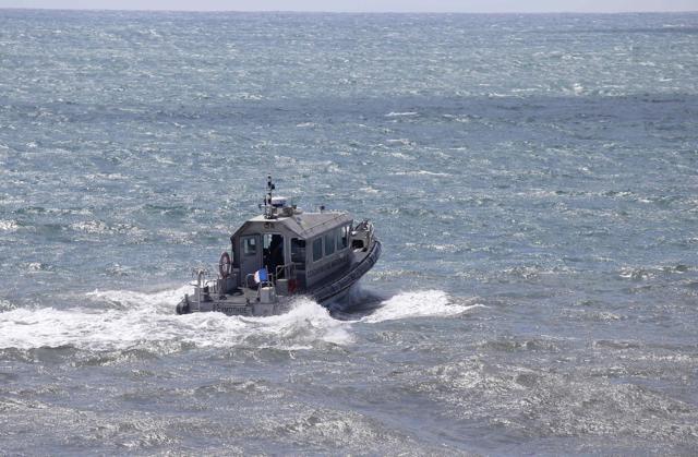 This file photo taken on August 14, 2015 shows a patrol boat of the French maritime gendarmerie taking part in the search for wreckage from the missing MH370 plane off the coast of Saint-Marie on the French island of La Reunion. (AFP) This file photo taken on August 14, 2015 shows a patrol boat of the French maritime gendarmerie taking part in the search for wreckage from the missing MH370 plane off the coast of Saint-Marie on the French island of La Reunion. (AFP)