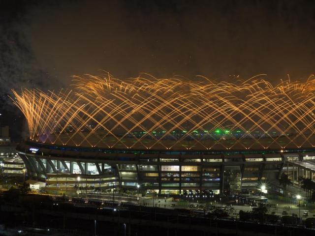 Fireworks explode above the Maracana stadium during the opening ceremony. (AP Photo)