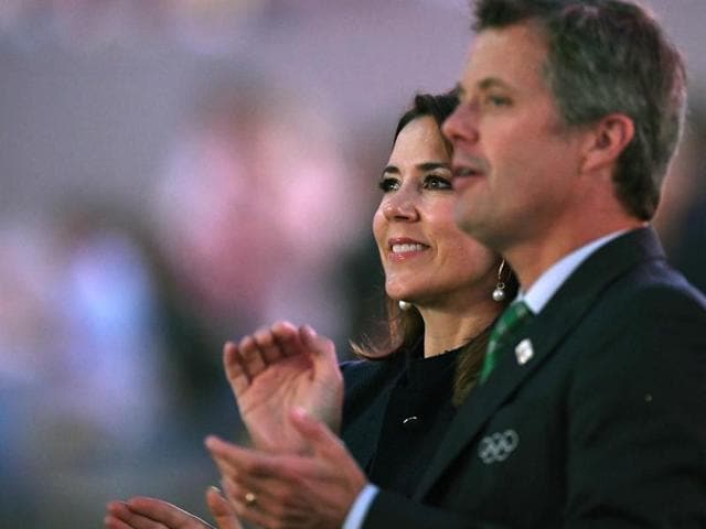Denmark's Princess Mary (left) and her husband Crown Prince Frederik applaud during the opening ceremony. (AP Photo)