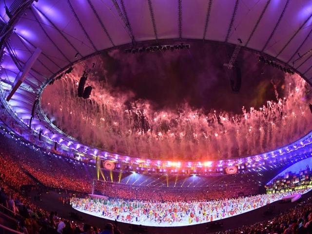 Fireworks explode above the stadium during the opening ceremony of the Rio 2016 Olympic Games. (AFP Photo)