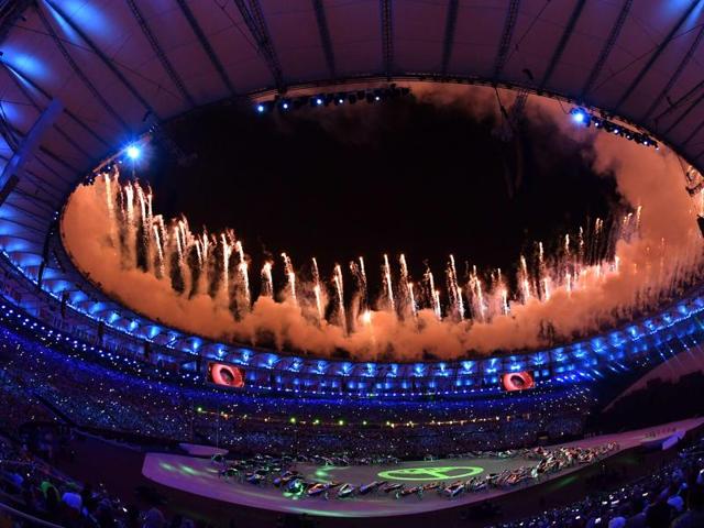 Fireworks explode above the stadium during the opening ceremony. (AFP Photo)