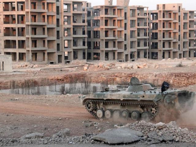 Opposition fighters drive a tank in an eastern government sieged neighbourhood of Aleppo as jihadists and their rebel allies pressed an offensive on August 5, 2016 . (AFP) Opposition fighters drive a tank in an eastern government sieged neighbourhood of Aleppo as jihadists and their rebel allies pressed an offensive on August 5, 2016 . (AFP)