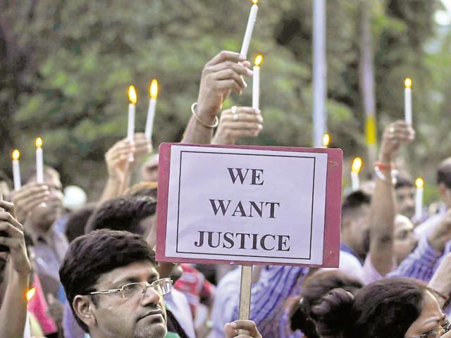 Residents take part in a candlelight protest near Noida stadium in Sector 22 to protest gainst the Bulandshahr gang rape and loot incident. (Sunil Ghosh/ HT photo) Residents take part in a candlelight protest near Noida stadium in Sector 22 to protest gainst the Bulandshahr gang rape and loot incident. (Sunil Ghosh/ HT photo)