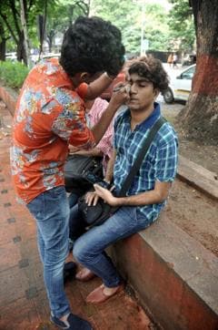 Participants paint their faces during the pro-LGBT rights march in Pune on Sunday. (HT Photo) Participants paint their faces during the pro-LGBT rights march in Pune on Sunday. (HT Photo)