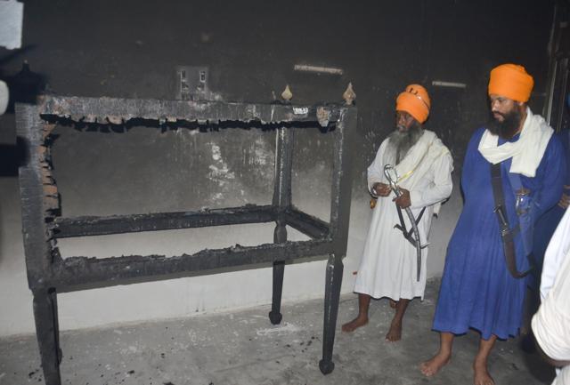 A burnt Palki Sahib at Baba Tehal Singh Nagar, Amritsar. (Sameer Sehgal/HT Photo)