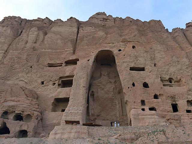 Visitors walk in front of the empty site of two Buddha statues, which were destroyed by the Taliban, in Bamiyan. (AFP File Photo) Visitors walk in front of the empty site of two Buddha statues, which were destroyed by the Taliban, in Bamiyan. (AFP File Photo)