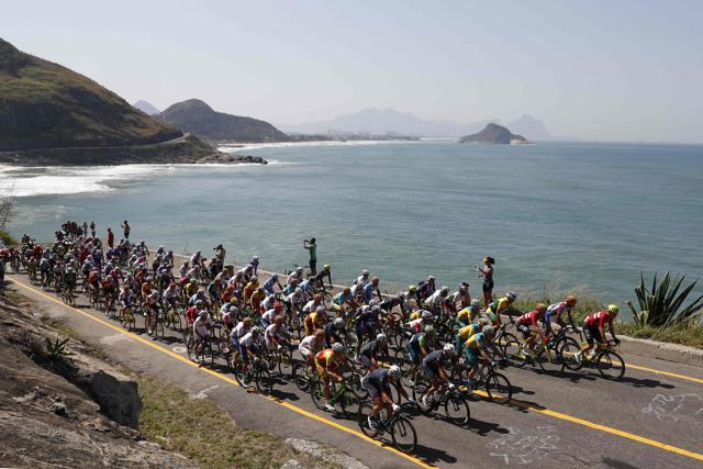 The peloton rides during the men's road cycling race in the Rio 2016 Olympic Games in Rio de Janeiro on Saturday. (AFP) The peloton rides during the men's road cycling race in the Rio 2016 Olympic Games in Rio de Janeiro on Saturday. (AFP)