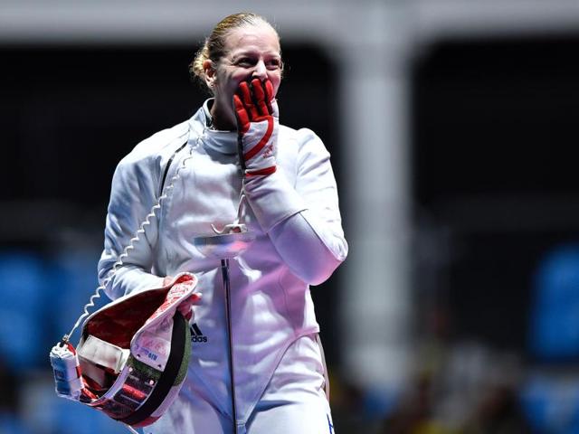 Hungary's Emese Szasz celebrates after winning the women’s individual epee gold medal bout as part of the fencing event of the Rio 2016 Olympic Games. (AFP Photo) Hungary's Emese Szasz celebrates after winning the women’s individual epee gold medal bout as part of the fencing event of the Rio 2016 Olympic Games. (AFP Photo)