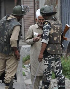 Paramilitary soldiers check the identity card of a local man on August 2, 2016. Walking around Srinagar has become near impossible with security forces and youths on motorbikes constantly checking on people found outdoors and shops operating their businesses. (Waseem Andrabi / HT Photo) Paramilitary soldiers check the identity card of a local man on August 2, 2016. Walking around Srinagar has become near impossible with security forces and youths on motorbikes constantly checking on people found outdoors and shops operating their businesses. (Waseem Andrabi / HT Photo)