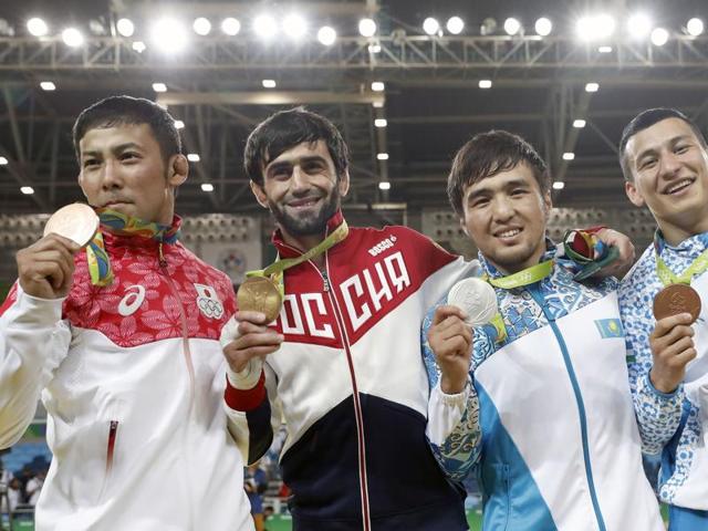 Russia's Beslan Mudranov, who clinched gold in the 60kg judo event, celebrates with silver medallist Kazakhstan's Yeldos Smetov and bronze medallist Uzbekistan's Diyorbek Urozboev. (AFP Photo) Russia's Beslan Mudranov, who clinched gold in the 60kg judo event, celebrates with silver medallist Kazakhstan's Yeldos Smetov and bronze medallist Uzbekistan's Diyorbek Urozboev. (AFP Photo)