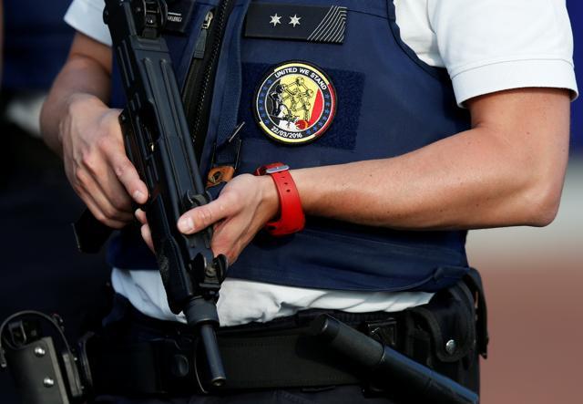 A Belgian police officer stands guard outside the main police station in Charleroi. (REUTERS) A Belgian police officer stands guard outside the main police station in Charleroi. (REUTERS)