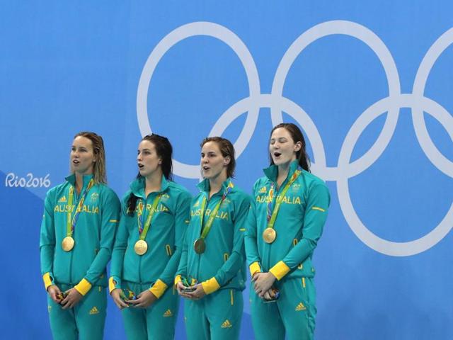 Australia's Emma McKeon, Brittany Elmslie, Bronte Campbell and Cate Campbell with their gold medals after winning the women's 4x100-meter freestyle relay final, setting a new world record. (AP Photo) Australia's Emma McKeon, Brittany Elmslie, Bronte Campbell and Cate Campbell with their gold medals after winning the women's 4x100-meter freestyle relay final, setting a new world record. (AP Photo)