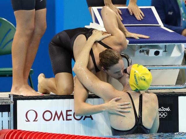 Australia's Cate Campbell, is greeted after anchoring the team to gold in the women's 4x100-meter freestyle. The team set a new world record with a time of 3:30.65secs (AP) Australia's Cate Campbell, is greeted after anchoring the team to gold in the women's 4x100-meter freestyle. The team set a new world record with a time of 3:30.65secs (AP)