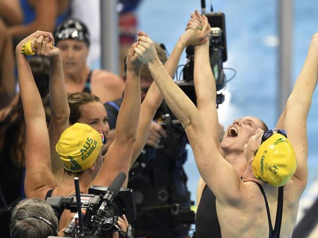 Australia's Emma McKeon, Brittany Elmslie, Bronte Campbell and Cate Campbell celebrate after winning the gold medal and setting a new world record in Rio de Janeiro, Brazil. (AP) Australia's Emma McKeon, Brittany Elmslie, Bronte Campbell and Cate Campbell celebrate after winning the gold medal and setting a new world record in Rio de Janeiro, Brazil. (AP)