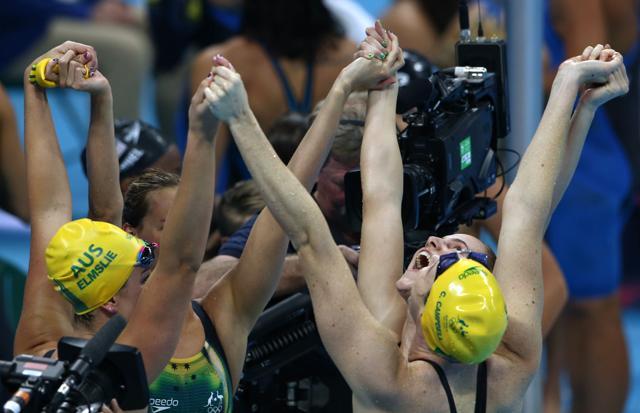 The Australia team celebrates after winning gold and setting a new world record. (REUTERS)