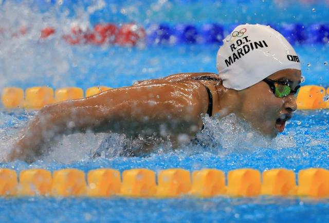 Mardini, who braved a Mediterranean crossing in a leaky dinghy fleeing war-torn Syria, won her 100m butterfly heat to launch an “amazing” Olympic experience. (REUTERS) Mardini, who braved a Mediterranean crossing in a leaky dinghy fleeing war-torn Syria, won her 100m butterfly heat to launch an “amazing” Olympic experience. (REUTERS)