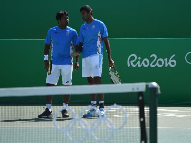 India's Leander Paes and Rohan Bopanna in action during the men's doubles tennis event. (AFP Photo) India's Leander Paes and Rohan Bopanna in action during the men's doubles tennis event. (AFP Photo)