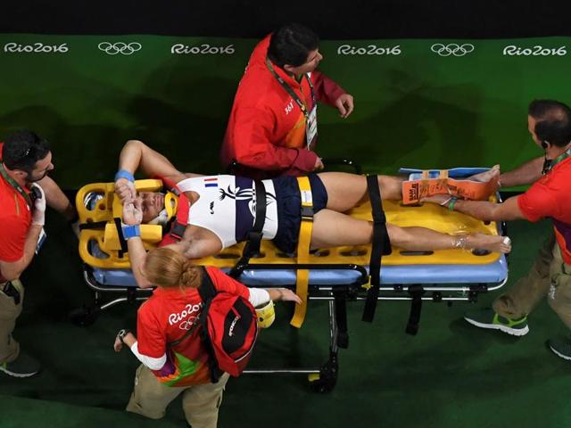 France's Samir Ait Said being stretchered off after being injured while competing in the qualifying for the men's vault event of the Artistic Gymnastics. (AFP Photo) France's Samir Ait Said being stretchered off after being injured while competing in the qualifying for the men's vault event of the Artistic Gymnastics. (AFP Photo)