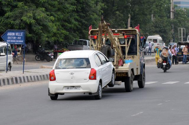 The rule is that vehicles parked at no parking zones be towed away to the nearest police station. The owner can take the vehicle only after submitting a fine of up to Rs 800. Part of the money goes to the traffic department and a larger portion to the MCG (Parveen Kumar/HT photo) The rule is that vehicles parked at no parking zones be towed away to the nearest police station. The owner can take the vehicle only after submitting a fine of up to Rs 800. Part of the money goes to the traffic department and a larger portion to the MCG (Parveen Kumar/HT photo)