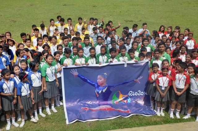 School children cheer for gymnast Dipa Karmakar at Don Bosco School in Agartala ahead of the start of Rio Olympics. (PTI Photo) School children cheer for gymnast Dipa Karmakar at Don Bosco School in Agartala ahead of the start of Rio Olympics. (PTI Photo)