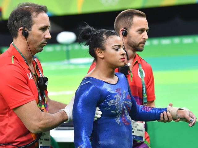 Britain's Elissa Downie speaks with her coach after an injury dueing qualifying for the women's floor event of the Artistic Gymnastics. (AFP Photo) Britain's Elissa Downie speaks with her coach after an injury dueing qualifying for the women's floor event of the Artistic Gymnastics. (AFP Photo)