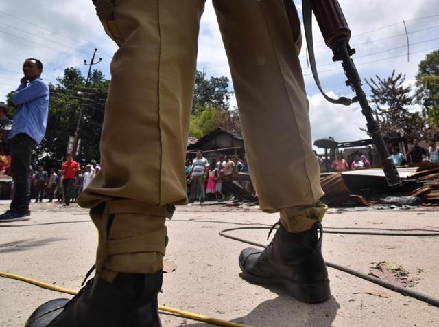 A securityman stands guard near the site of a militant attack on a market at Balajan Tinali in Kokrajhar district of Assam. (AFP) A securityman stands guard near the site of a militant attack on a market at Balajan Tinali in Kokrajhar district of Assam. (AFP)