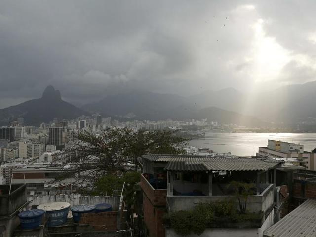 The sun shines through a cloud over the Lagoa Rodrigo de Freitas after competition was postponed due to high winds. (REUTERS) The sun shines through a cloud over the Lagoa Rodrigo de Freitas after competition was postponed due to high winds. (REUTERS)
