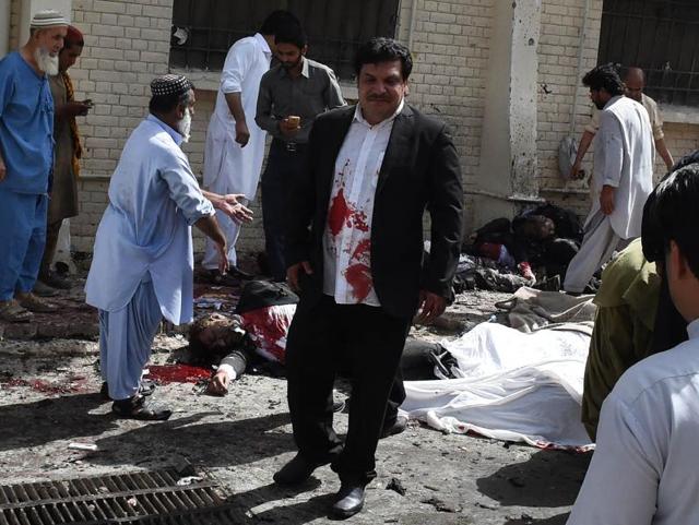 Pakistani volunteers use a trolley to move the body of a lawyer after a suicide attack at the Civil Hospital in Quetta on Monday. At least 70 people were killed in the attack in the southwestern Pakistani city. (AFP) Pakistani volunteers use a trolley to move the body of a lawyer after a suicide attack at the Civil Hospital in Quetta on Monday. At least 70 people were killed in the attack in the southwestern Pakistani city. (AFP)