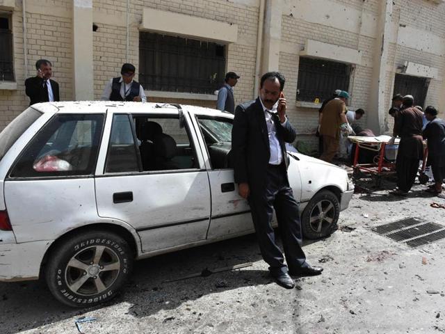 There was blood everywhere at the site of blasts, with bodies lying all over. Pakistani lawyers talk on mobiles next to bodies of their colleagues after a bomb explosion at a government hospital premises in Quetta on Monday. (AFP) There was blood everywhere at the site of blasts, with bodies lying all over. Pakistani lawyers talk on mobiles next to bodies of their colleagues after a bomb explosion at a government hospital premises in Quetta on Monday. (AFP)