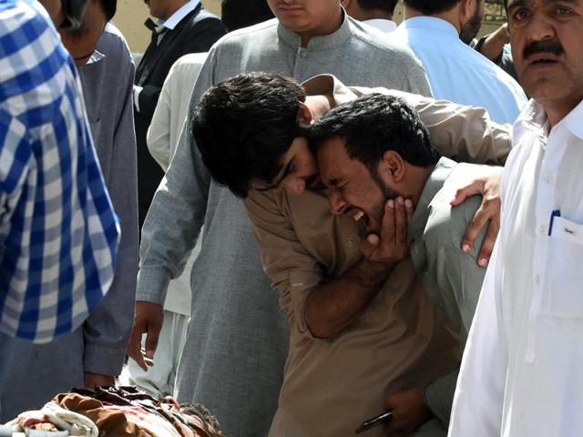 Pakistani local journalists react over the body of a news cameraman after the bomb explosion in Quetta.Two journalists – Dawn News cameraman Mahmood Khan and Shahzad Khan, a cameraman associated with Aaj TV – were killed by the blast. (AFP) Pakistani local journalists react over the body of a news cameraman after the bomb explosion in Quetta.Two journalists – Dawn News cameraman Mahmood Khan and Shahzad Khan, a cameraman associated with Aaj TV – were killed by the blast. (AFP)