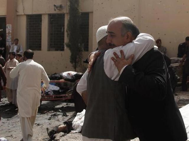 Friends and relatives of victims grieve at the scene of a bomb blast outside the hospital in Quetta. Nearly 100 more were injured in what was one of the deadliest terror attacks in the country in recent years. (Reuters) Friends and relatives of victims grieve at the scene of a bomb blast outside the hospital in Quetta. Nearly 100 more were injured in what was one of the deadliest terror attacks in the country in recent years. (Reuters)