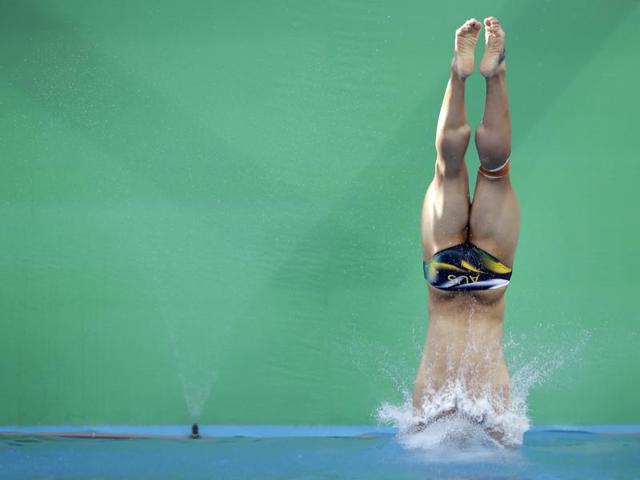 Diving also makes for the perfect photograph. A diver from Australia gives this photographer one for the day. (Wong maye-E/AP)