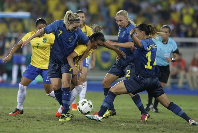 A five-time Fifa World Player of the Year (woman), and Brazil’s leading goal scorer, Marta is often heavily marked by opposition players. (Leo Correa/AP)