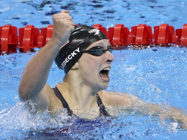 2016 Rio Olympics - Swimming - Final - Women's 400m Freestyle Final - Olympic Aquatics Stadium - Rio de Janeiro, Brazil - 07/08/2016. Katie Ledecky (USA) of USA celebrates after setting a new world record. REUTERS/Marcos Brindiccir FOR EDITORIAL USE ONLY. NOT FOR SALE FOR MARKETING OR ADVERTISING CAMPAIGNS. (REUTERS) 2016 Rio Olympics - Swimming - Final - Women's 400m Freestyle Final - Olympic Aquatics Stadium - Rio de Janeiro, Brazil - 07/08/2016. Katie Ledecky (USA) of USA celebrates after setting a new world record. REUTERS/Marcos Brindiccir FOR EDITORIAL USE ONLY. NOT FOR SALE FOR MARKETING OR ADVERTISING CAMPAIGNS. (REUTERS)